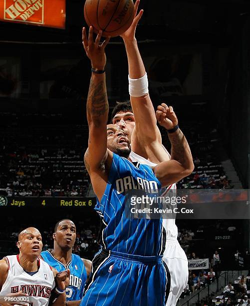 Jameer Nelson of the Orlando Magic against Zaza Pachulia of the Atlanta Hawks during Game Four of the Eastern Conference Semifinals of the 2010 NBA...