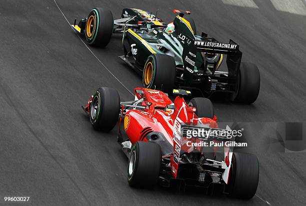 Jarno Trulli of Italy and Lotus leads from Fernando Alonso of Spain and Ferrari during the Monaco Formula One Grand Prix at the Monte Carlo Circuit...