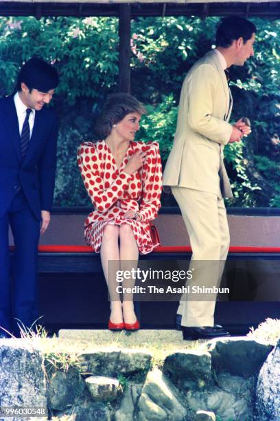 Prince Charles, Prince of Wales, Princess Diana, Princess of Wales and Prince Naruhito stroll the garden of the Shugakuin Imperial Villa on May 9,...