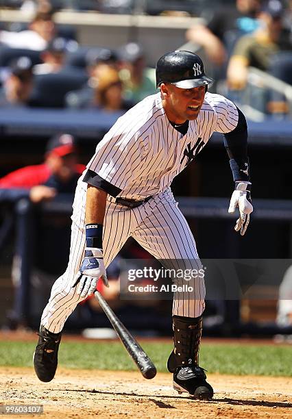 Derek Jeter of The New York Yankees hits a single against the Minnesota Twins during their game on May 16, 2010 at Yankee Stadium in the Bronx...