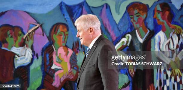 German Interior Minister Horst Seehofer arrives for the weekly cabinet meeting in Berlin on July 11, 2018.