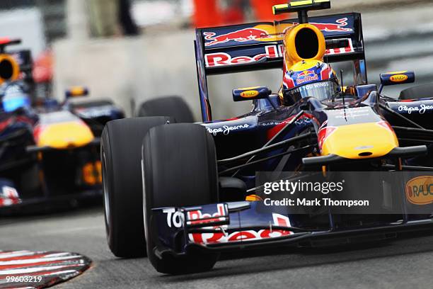 Mark Webber of Australia and Red Bull Racing leads from team mate Sebastian Vettel of Germany and Red Bull Racing on his way to winning the Monaco...