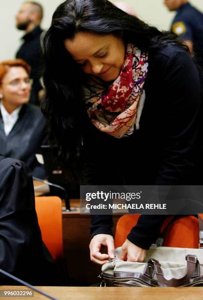 Defendant Beate Zschaepe arrives in a courtroom before the proclamation of sentence in her trial as the only surviving member of neo-Nazi cell...