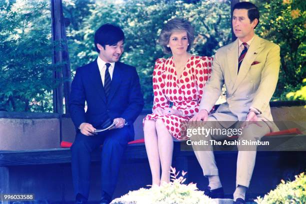 Prince Charles, Prince of Wales, Princess Diana, Princess of Wales and Prince Naruhito stroll the garden of the Shugakuin Imperial Villa on May 9,...