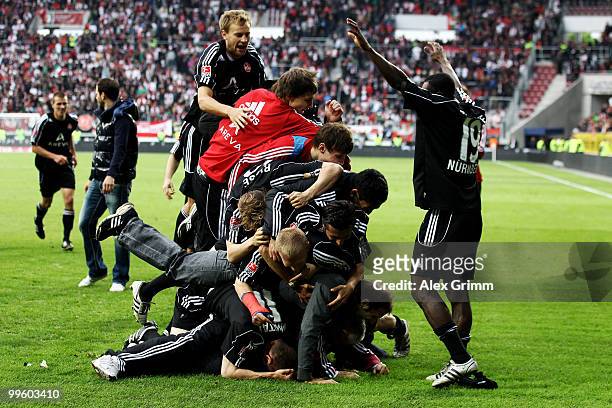 Players of Nuernberg celebrate after the Bundesliga play off leg two match between FC Augsburg and 1. FC Nuernberg at the Impuls Arena on May 16,...