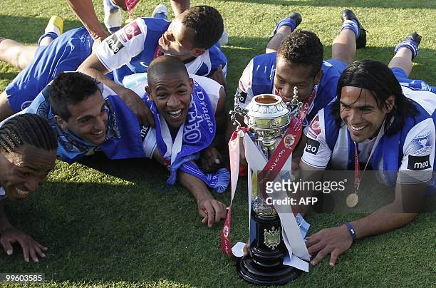 Porto´s team captain Porto´s Colombian forward Radamel Falcao and teammates pose with the trophy after their victory over Chaves on their Portugual...