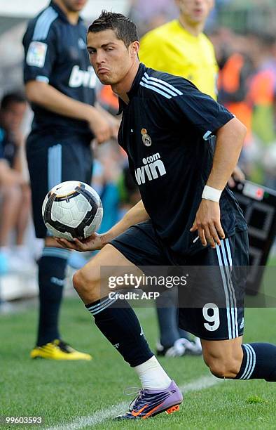 Real Madrid's Portuguese forward Cristiano Ronaldo reacts during a football match against Malaga at La Rosaleda's stadium in Malaga, on May 16,...