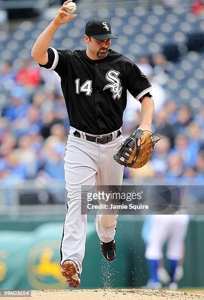 Paul Konerko of the Chicago White Sox runs across the mound after catching the final out of the 3rd inning during the game against the Kansas City...