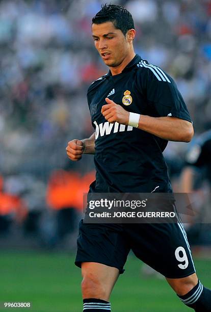 Real Madrid's Portuguese forward Cristiano Ronaldo gestures during a Spanish league football match against Malaga at Rosaleda stadium on May 16,...