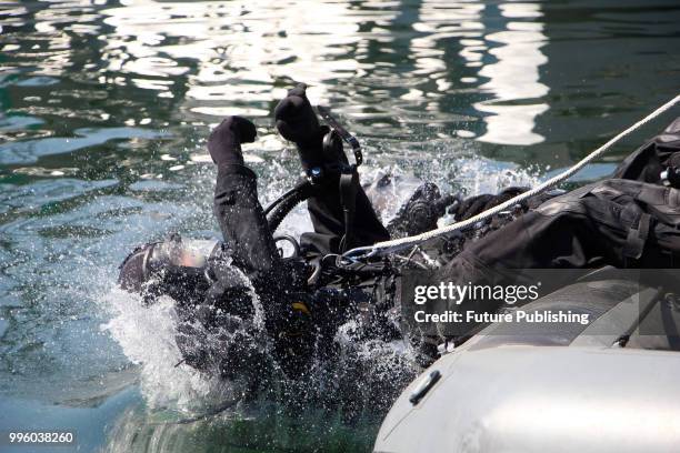 Diver of the Royal Canadian Navy plunges backwards during diver component drills held as part of the Exercise Sea Breeze 2018, Odesa, southern...