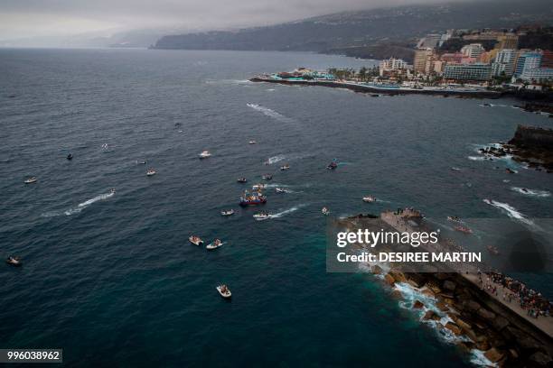 An aerial view taken with a drone on July 10, 2018 shows the Virgin del Carmen festivity, honouring the patron saint of fishermen, at the Puerto de...