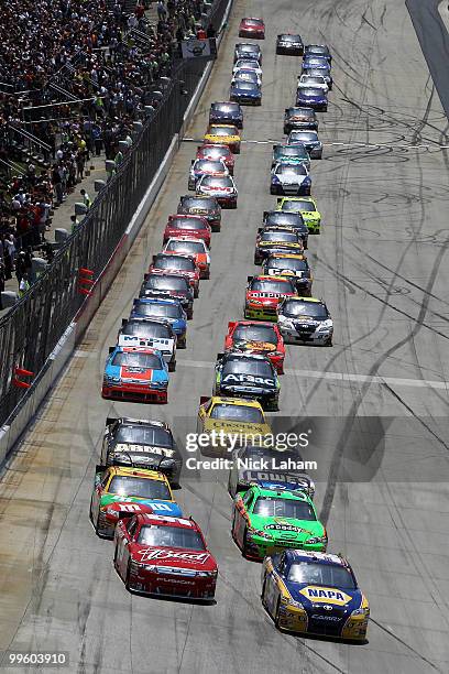 Martin Truex Jr., driver of the NAPA Auto Parts Toyota, and Kasey Kahne, driver of the Budweiser Ford, lead the field during the NASCAR Sprint Cup...