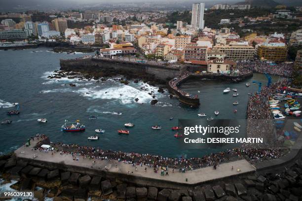 An aerial view taken with a drone on July 10, 2018 shows the Virgin del Carmen festivity, honouring the patron saint of fishermen, at the Puerto de...