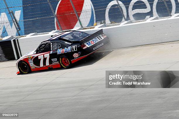 Sam Hornish Jr., driver of the Mobil 1 Dodge, crashes into the wall during the NASCAR Sprint Cup Series Autism Speaks 400 at Dover International...