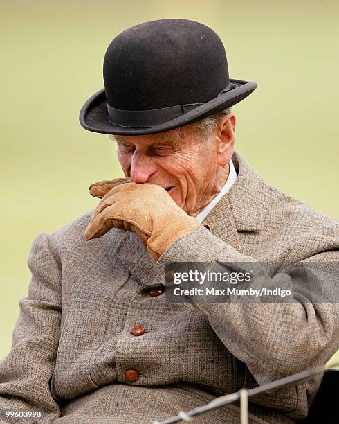 Prince Philip, The Duke of Edinburgh wipes his nose with his glove whilst carriage driving in the Laurent Perrier meet of the British Driving Society...