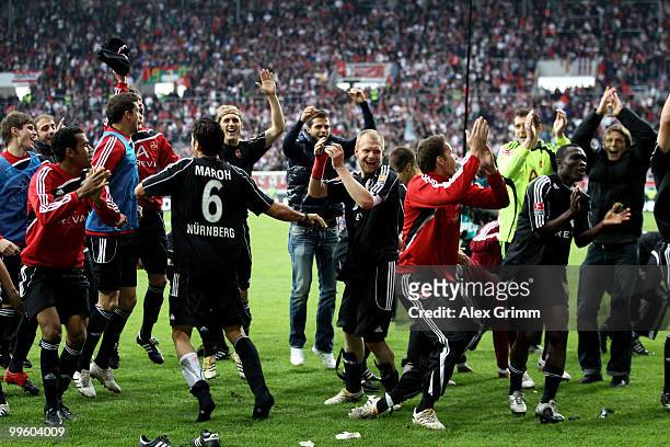 Players of Nuernberg celebrate after winning the Bundesliga play off leg two match between FC Augsburg and 1. FC Nuernberg at the Impuls Arena on May...