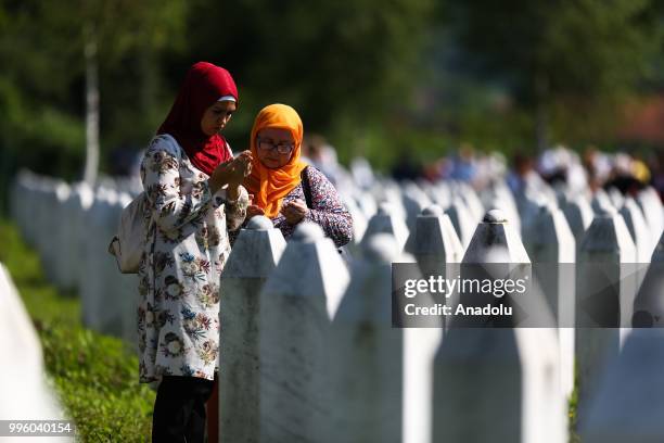Relatives of Srebrenica victims wait for burial of 35 victims at the Potocari Monument Cemetery in Srebrenica, Bosnia and Herzegovina on July 11,...