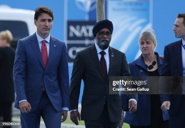 Canadian Prime Minister Justin Trudeau and Canadian Defense Minister Harjit Sajjan arrive at the 2018 NATO Summit at NATO headquarters on July 11,...