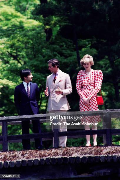 Prince Charles, Prince of Wales, Princess Diana, Princess of Wales and Prince Naruhito stroll the garden of the Shugakuin Imperial Villa on May 9,...