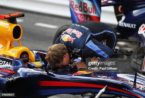 Sebastian Vettel of Germany and Red Bull Racing checks his car following the Monaco Formula One Grand Prix at the Monte Carlo Circuit on May 16, 2010...