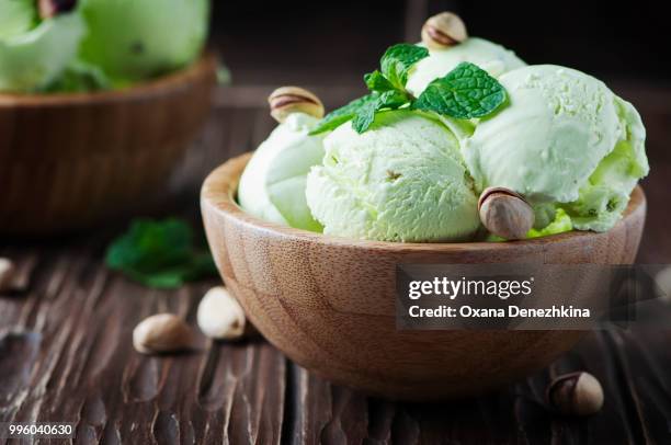 pistachio icecream with mint and nuts - mint ice cream stock pictures, royalty-free photos & images
