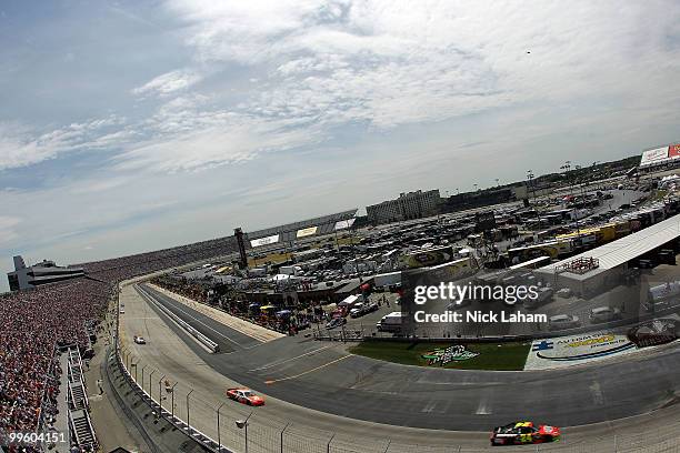 Jeff Gordon, driver of the DuPont Chevrolet, leads Joey Logano, driver of the The Home Depot Toyota, during the NASCAR Sprint Cup Series Autism...