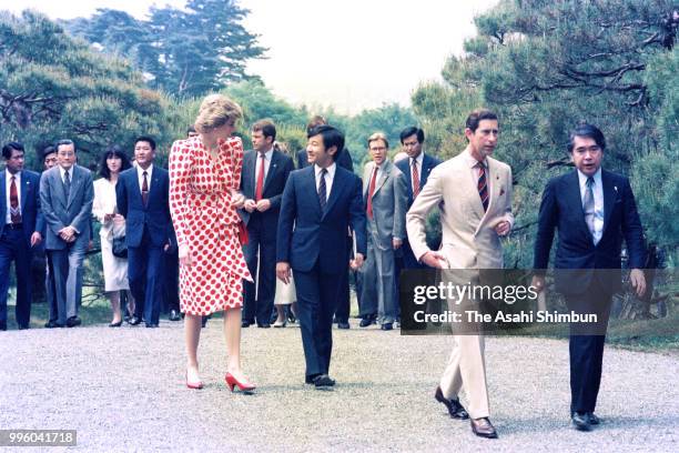 Prince Charles, Prince of Wales, Princess Diana, Princess of Wales and Prince Naruhito stroll the garden of the Shugakuin Imperial Villa on May 9,...