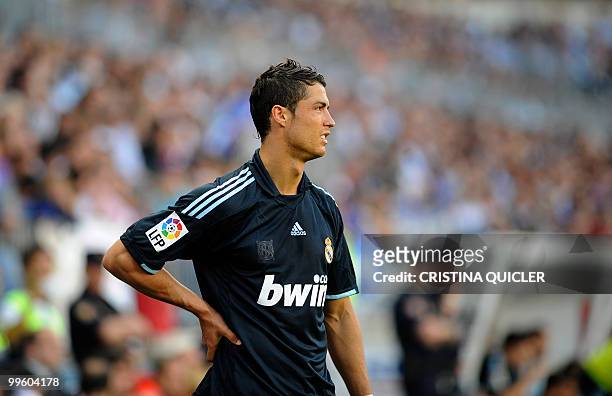 Real Madrid's Portuguese forward Cristiano Ronaldo reacts during a Spanish league football match against Malaga at La Rosaleda's stadium in Malaga,...
