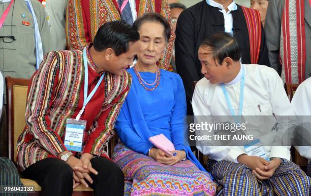 Myanmar Vice President Henry Van Thio , Myanmar's Foreign Minister and State Counsellor Aung San Suu Kyi and Myanmar President Win Myint speak after...