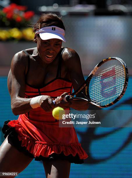 Venus Williams of the USA plays a backhand to Aravane Rezai of France in their final match during the Mutua Madrilena Madrid Open tennis tournament...