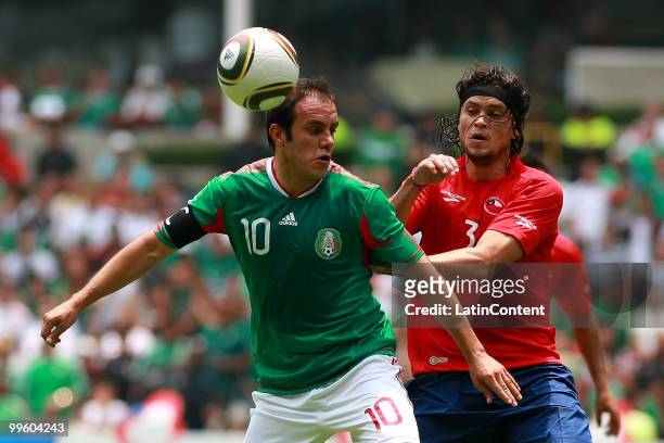 Cuauhtemoc Blanco of Mexico fights for the ball with Waldo Ponce of Chile during a friendly match as part of the Mexico National team preparation for...