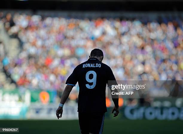 Real Madrid's Portuguese forward Cristiano Ronaldo reacts during a Spanish league football match against Malaga at La Rosaleda's stadium in Malaga,...