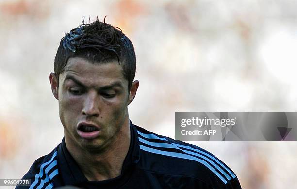 Real Madrid's Portuguese forward Cristiano Ronaldo reacts during a Spanish league football match against Malaga at La Rosaleda's stadium in Malaga,...