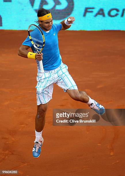 Rafael Nadal of Spain celebrates a break point against Roger Federer of Switzerland in the mens final match during the Mutua Madrilena Madrid Open...