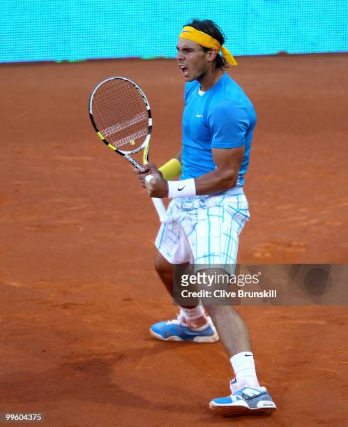 Rafael Nadal of Spain celebrates a point against Roger Federer of Switzerland in the mens final match during the Mutua Madrilena Madrid Open tennis...