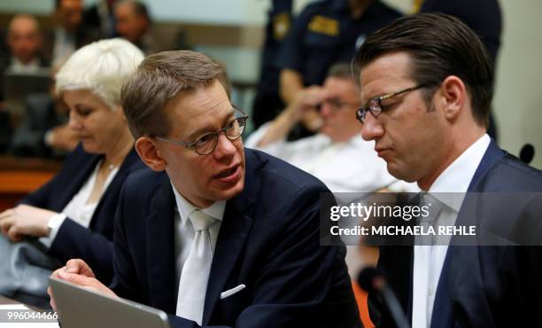 Anja Sturm, Wolfgang Heer and Wolfgang Stahl, lawyer of defendant Beate Zschaepe wait in a courtroom before the proclamation of sentence in the trial...