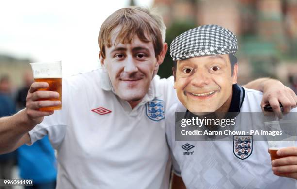 England fans wearing face masks of Only Fools and Horses characters Derek Trotter and Rodney Trotter in Red Square ahead of the FIFA World Cup, Semi...