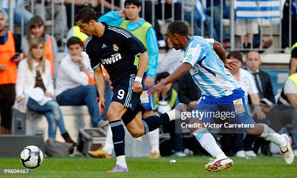 Cristiano Ronaldo of Real Madrid runs with the ball during the La Liga match between Malaga and Real Madrid at La Rosaleda Stadium on May 16, 2010 in...