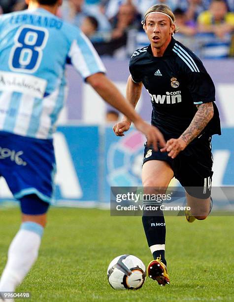 Guti of Real Madrid runs with the ball during the La Liga match between Malaga and Real Madrid at La Rosaleda Stadium on May 16, 2010 in Malaga,...