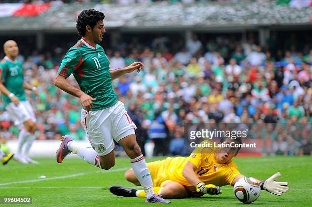 Carlos Vela of Mexico fights for the ball with Luis Marin, Goalkeeper of Chile , during a friendly match as part of the Mexico National team...