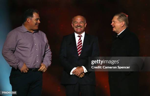 Mal Meninga, Wally Lewis and Paul Vautin appear on stage during a Captain's tribute before game three of the State of Origin series between the...