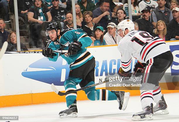 Jonathan Toews of the Chicago Blackhawks defends against Jason Demers of the San Jose Sharks in Game One of the Western Conference Finals during the...
