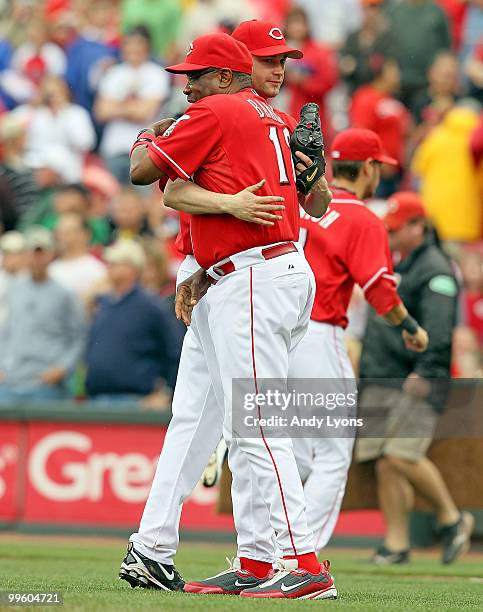 Bronson Arroyo of the Cincinnati Reds hugs manager Dusty Baker after pitching a complete game against the St. Louis Cardinals at Great American Ball...
