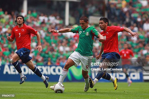 Javier Hernandez of Mexico fights for the ball with Gonzalo Jara of Chile , during a friendly match as part of the Mexico National team preparation...
