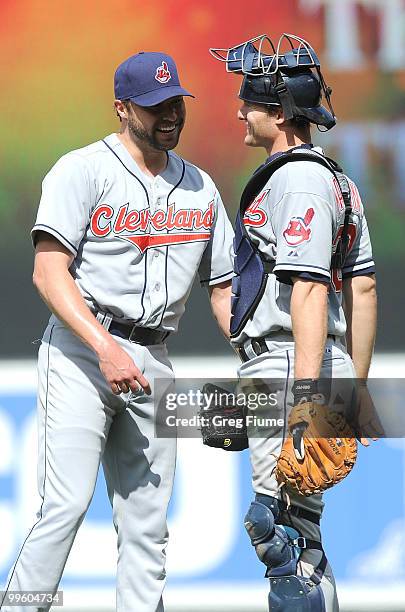 Jake Westbrook of the Cleveland Indians celebrates with Lou Marson after a 5-1 victory over the Baltimore Orioles at Camden Yards on May 16, 2010 in...