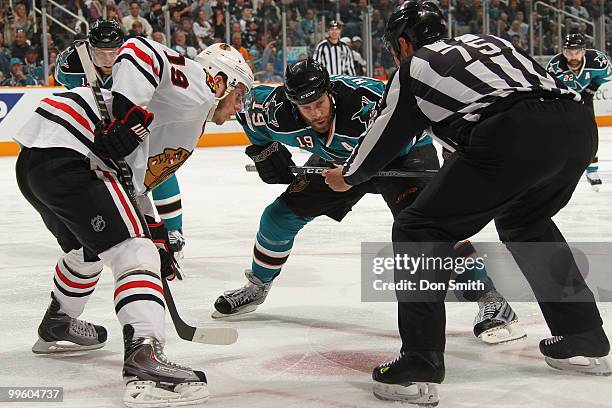 Jonathan Toews of the Chicago Blackhawks takes a faceoff against Joe Thornton of the San Jose Sharks in Game One of the Western Conference Finals...