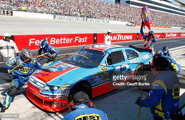 Allmendinger, driver of the Richard Petty Hall of Fame Ford, pits during the NASCAR Sprint Cup Series Autism Speaks 400 at Dover International...