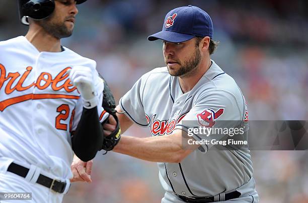 Jake Westbrook of the Cleveland Indians tags out Nick Markakis of the Baltimore Orioles at Camden Yards on May 16, 2010 in Baltimore, Maryland.