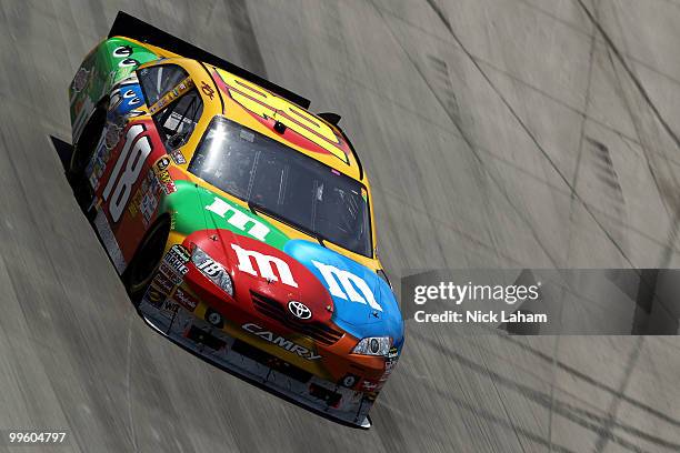 Kyle Busch, driver of the M&M's Toyota, leads the field during the NASCAR Sprint Cup Series Autism Speaks 400 at Dover International Speedway on May...