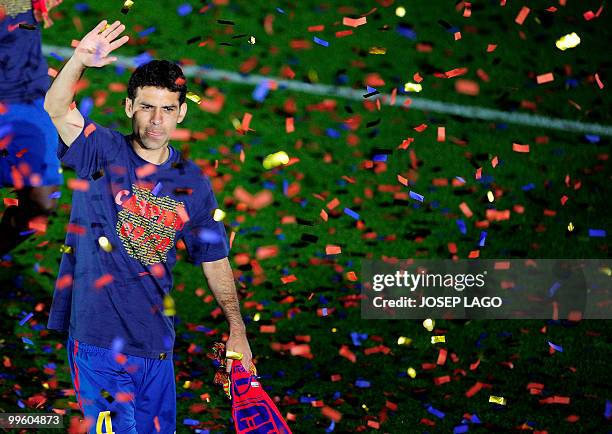 Barcelona's Mexican defender Rafa Marquez celebrates after winning the Spanish La Liga title at Camp Nou stadium in Barcelona on May 16, 2010....